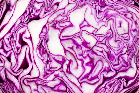 Diet snack. Red cabbage salad with corn grains in a plate in half a head of cabbage on a cutting...