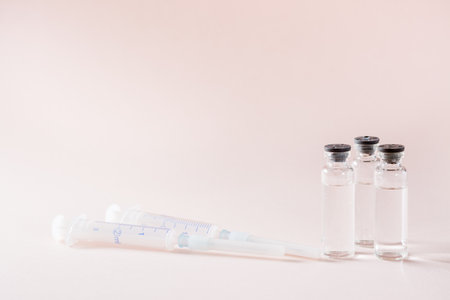 Vaccination and Immunization. Vaccine vials and clean syringesの写真素材