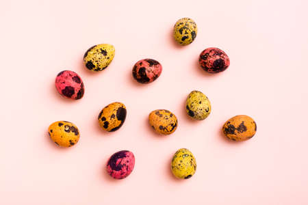 Happy Easter. Painted quail eggs on a pink backgroundの写真素材