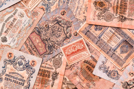 Chaotically scattered old worn ruble banknotes of royal russia. Top viewの写真素材