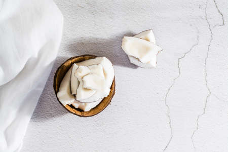 Pieces of ripe coconut on the table. tropical fruits. natural source of antioxidants. top view....