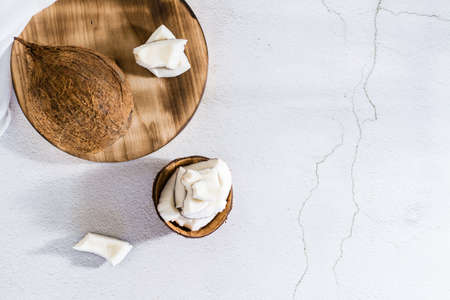 Pieces of ripe coconut on the table. tropical fruits. natural source of antioxidants. top view