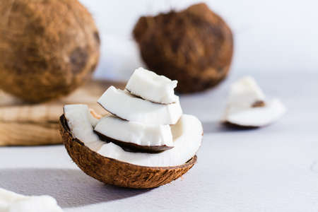 Pieces of ripe coconut on the table. tropical fruits. natural source of antioxidants. close-up