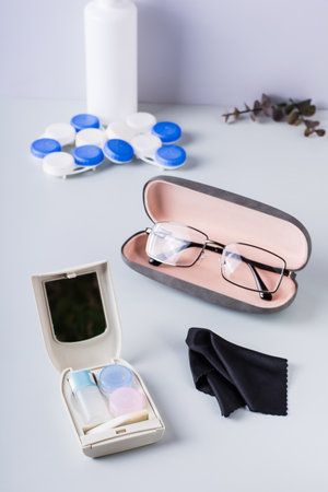Box for storing contact lens care items and glasses in a case. Choosing a vision correction method....