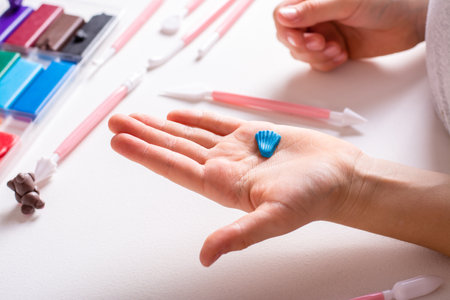 Detail for a product made of polymer clay in children's hands. Handmade and leisure.の写真素材