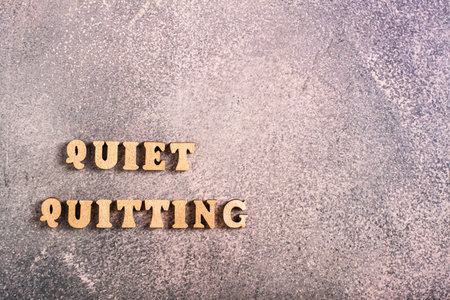 Quiet quitting wooden letters. Do nothing beyond your official duties.の写真素材