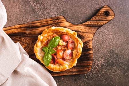 Close up of Chicago pizza pot pie with sausage, tomatoes and cheese on a board top viewの写真素材