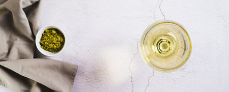 Refreshing green matcha martini in a glass on the table top view web bannerの写真素材