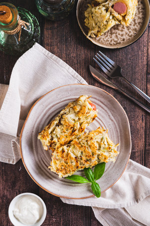 Cabbage rolls with sausages on a plate on the table top and vertical viewの写真素材