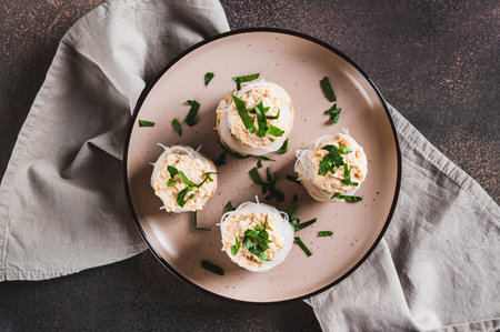Close up of appetizer of champignons, funchose and capelin caviar on a plate top viewの写真素材
