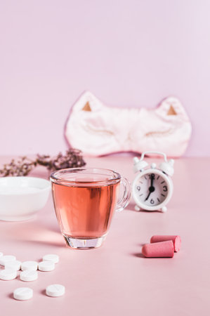 Insomnia remedies and sleep accessories on the table vertical viewの写真素材