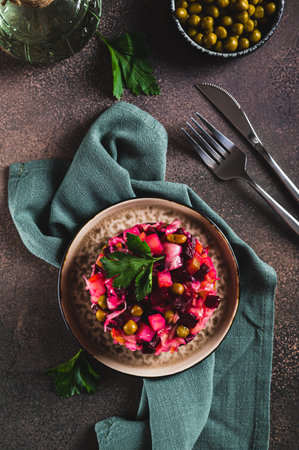 Vegetable vegetarian salad vinaigrette with oil on a plate on the table top and vertical viewの写真素材