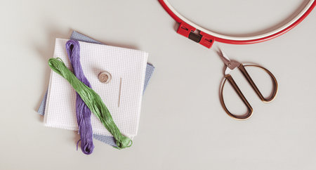 Embroidery kit on gray background top view web bannerの写真素材