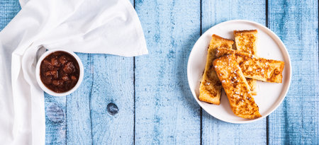 Golden sweet croutons of bread on a plate on the table top view web bannerの写真素材