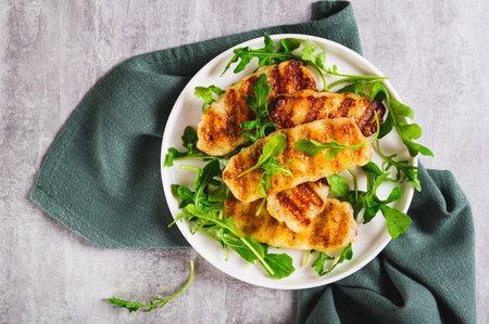Close up of warm salad with grilled halloumi and arugula on a plate on the table top view