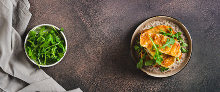 Grilled halloumi and arugula sandwich on a plate on a table top view web bannerの写真素材
