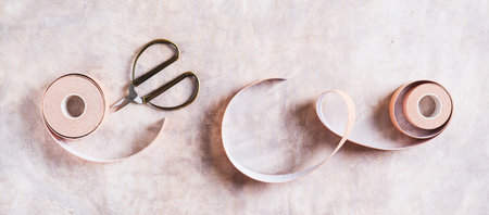 Beige special physical tapes for face and body on the table top view web banner