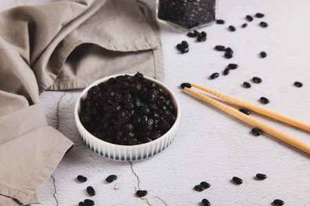 Asian fermented black beans on a plate on the table