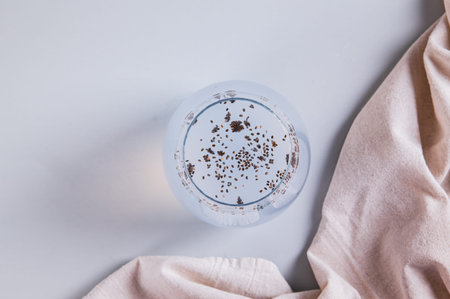 Close up of detox coconut water with chia seeds in a glass on the table top viewの写真素材