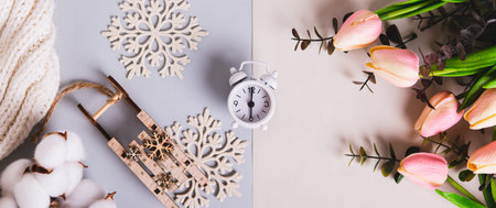 Alarm clock between winter and summer, the day of the vernal equinox top view web bannerの写真素材