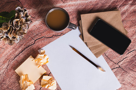 Concept of writing a resume for a job application, paper and pen on the table top view