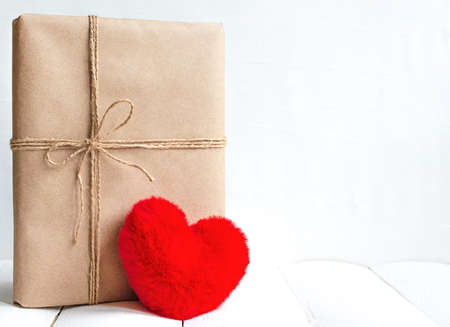 Love present in craft paper box with red heart and copy spaceの写真素材