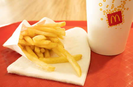 Kursk, Russia - may 28, 2021: McDonalds meal on red tray, includes coke cup, French Friesのeditorial素材