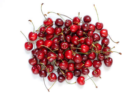 Fresh Cherry berries with stems on white background. Top view.