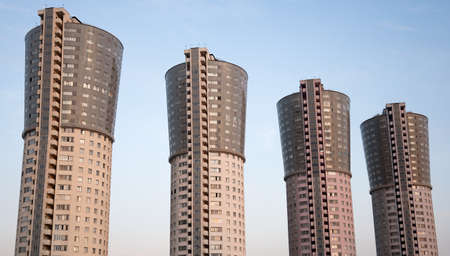four tall identical houses against the skyの写真素材