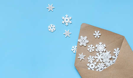 craft envelope with snowflakes on a blue background.の写真素材