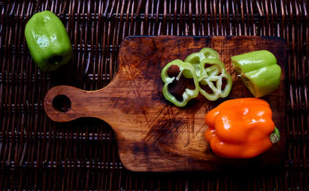Green and red pepper cutted  on the boradの写真素材