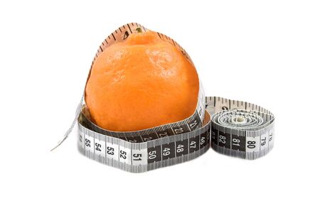 Orange naartjie with measuring tape on white background. Copy space.の写真素材