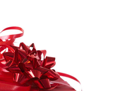 Red gift box with bows isolated on white background with lots of copy spaceの写真素材