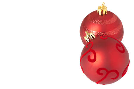Two red Christmas baubles isolated on white background with copy space. Shallow depth of fieldの写真素材