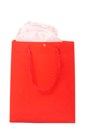 Red gift bag for Valentines day with rose paper isolated on white background