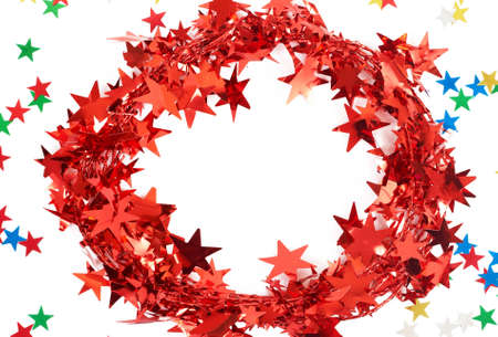 Red Christmas tinsel with stars isolated on white background with copy space. の写真素材