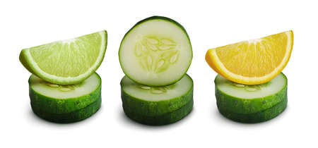 Slices of cucumber with lemon and lime isolated on white background. Vegetable set. Refreshing combination.の写真素材