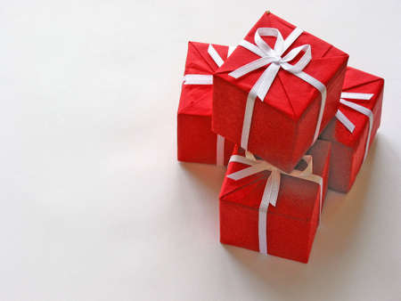 Red gift boxes on white background with open space for textの写真素材