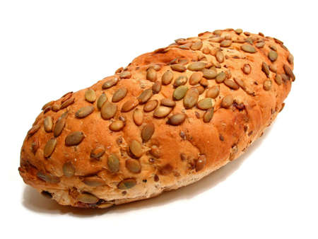 Loaf of artisan pumpkin seed and cranberry bread on white background