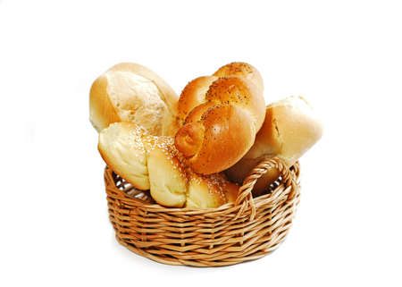 Small basket filled with buns isolated on white backgroundの写真素材