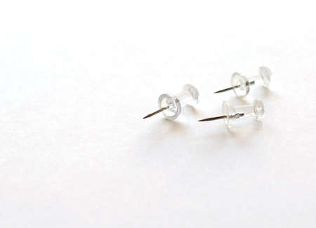 Three clear pins on white backgroundの写真素材