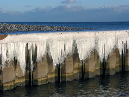 Icicles on a pier in the winterの写真素材