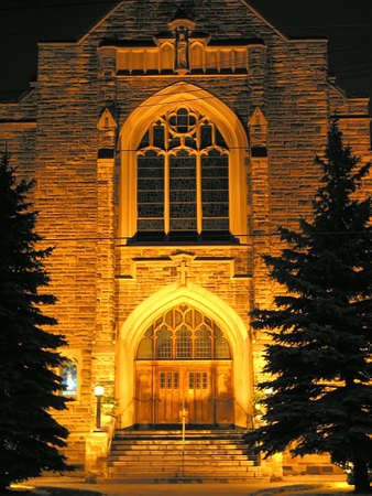 Beautifully illuminated church building at nightの写真素材