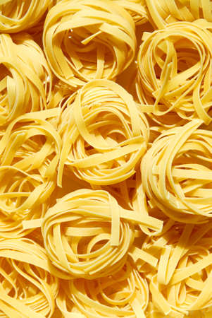 Dry pasta tagliatelli nestsの写真素材