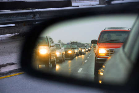 Feflection of a traffic jam in a sideview mirror