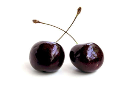 Two fresh cherries on whiteの写真素材