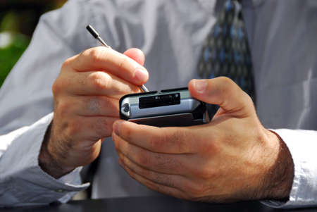 Businessman's hands holding pda