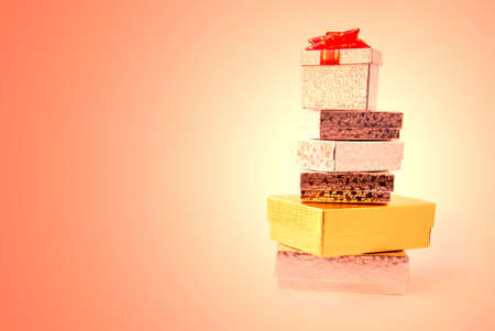 Stacked gift boxes on colored backgroundの写真素材