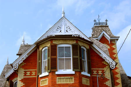 Fragment of a beautiful red brick victorian houseの写真素材
