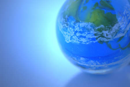 Globe on blue background as globalization conceptの写真素材